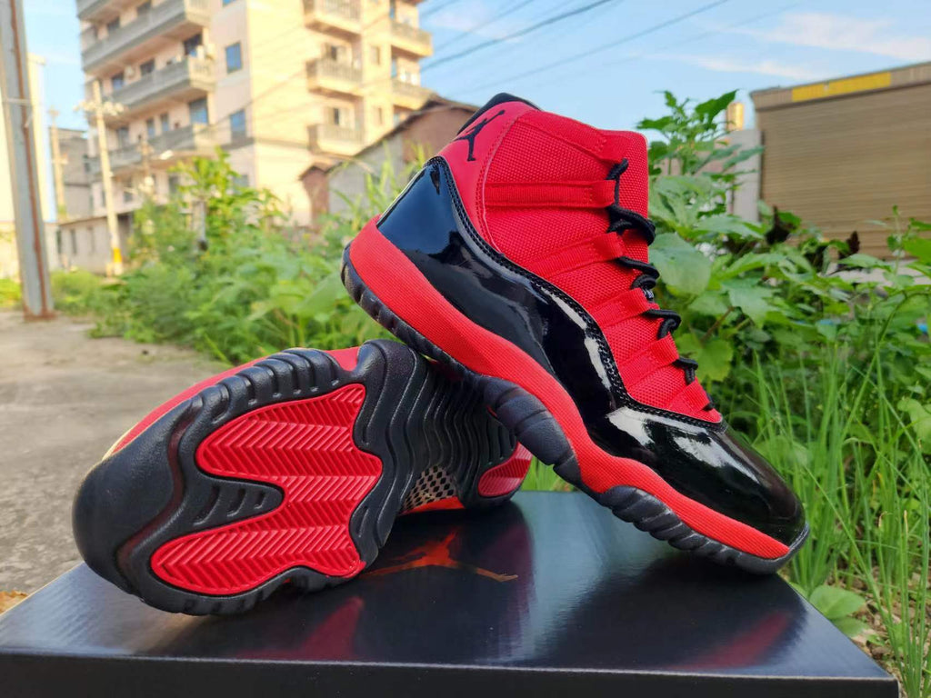 Air Jordan 11 Red and Black Sneakers