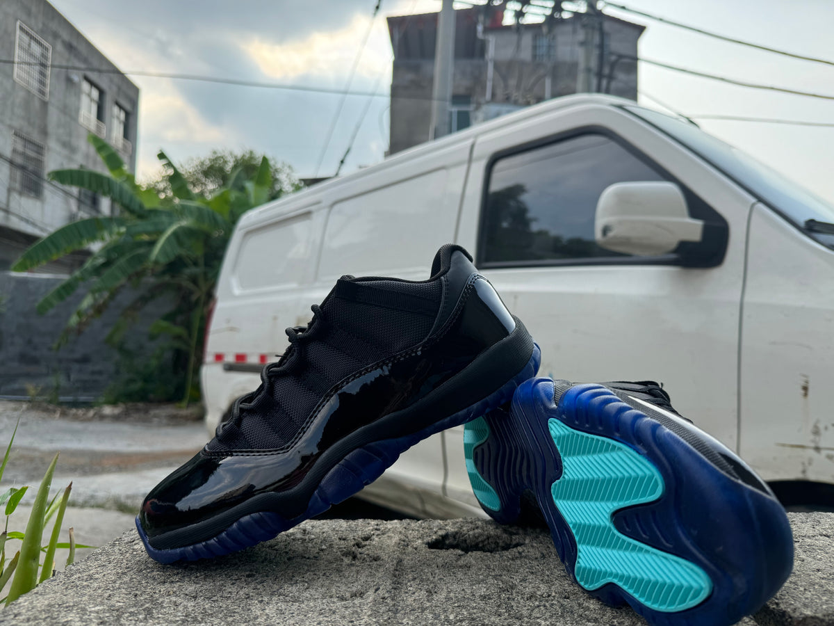 Air Jordan 11 Black and Gamma Blue Sneakers