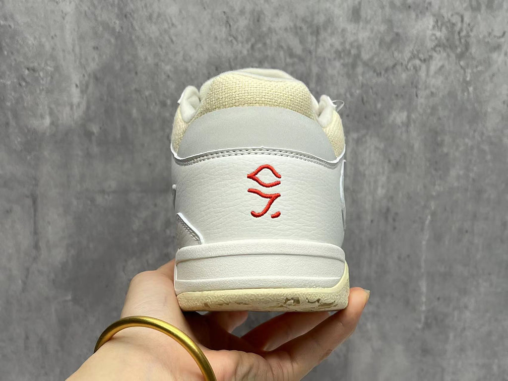 Travis Scott Cream and Yellow Sneakers
